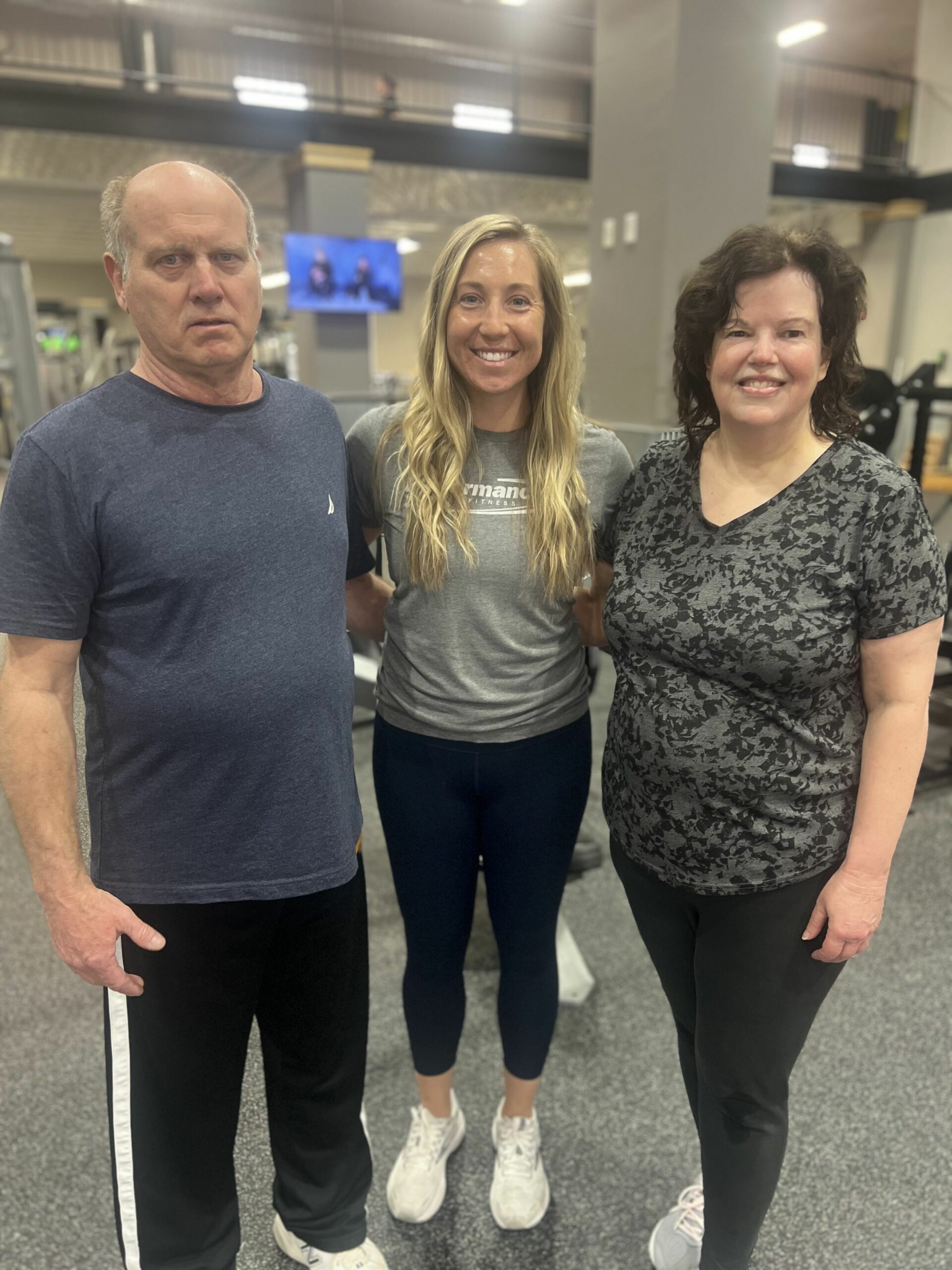 Kelsey with her clients, Ron and Carol
